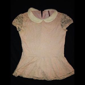 Pink blouse. Pearl Necklace